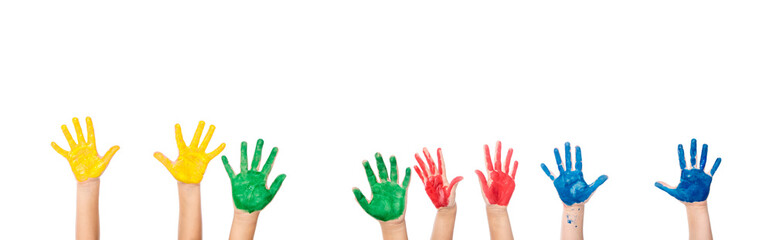 Cropped view of hands of children in colorful paint isolated on white, banner