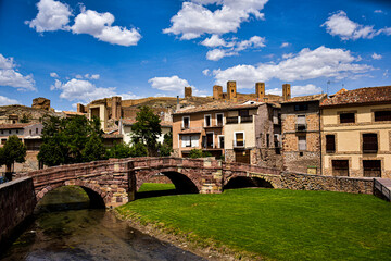 Naklejka na ściany i meble Localidad de Molina de Aragon (Guadalajara - España), con su puente romano y castillo al fondo