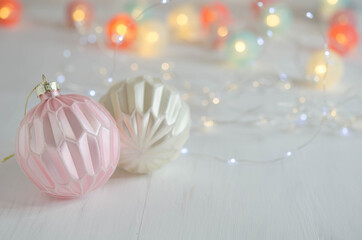 Christmas balls and garland on a blurred background.