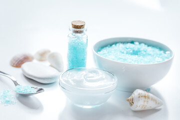 sea salt and body cream on white desk background