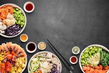Top view of poke bowls composition with various sauces