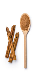 wooden scoop with ground cinnamon and stick on white background