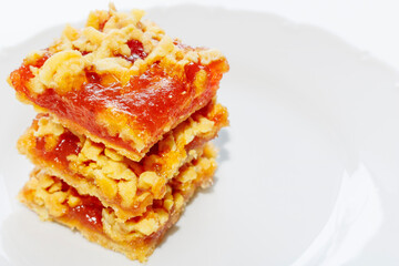 Pie with Apple jam and shortbread layers on a white background. Holiday cake is delicious and healthy
