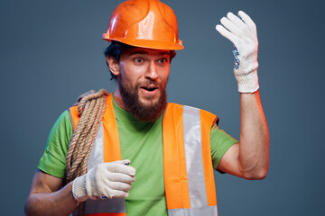 emotional man in work uniform safety professional blue background