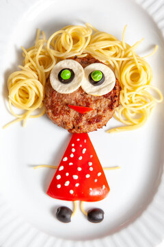 Naklejki Children's menu. health food for children. cutlets, spaghetti, vegetables, brightly and cheerful cooked. funny girl in a red dress with white polka dots with a curly hairstyle