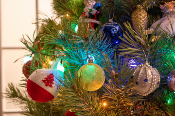 Decorated christmas tree indoors. New year's decoration close up.