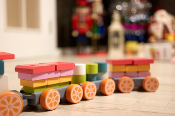 Colorful toy block train close up. Toy railway carriage.