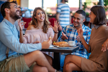 Friends eating in a cafe
