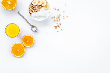 Fototapeta na wymiar food for healthy breakfast with granola and fresh orange juice on bright white background top view mock up