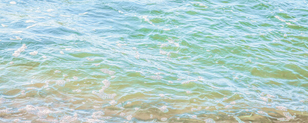 crystal clear azure water with sea foam, seascape background