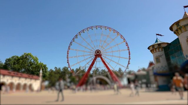 Amusement park, amusement park. Big ferris wheel in the park