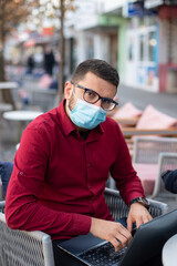 Man with face mask and glasses