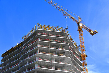 Crane and highrise construction site