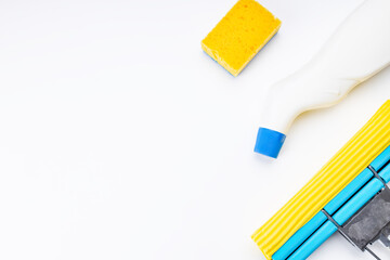 housework cleaning supply isolated with copy space. above view. studio shot. sponge mop and detergent for housekeeping
