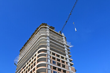 Crane and highrise construction site