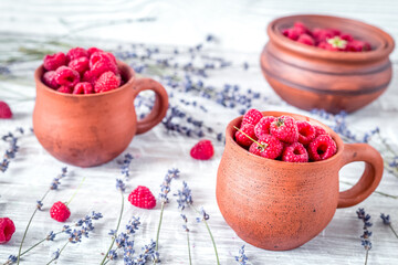 fresh raspberry and dry lavander in rustic design on wooden background