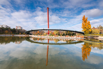 Autumn landscape of Drumul Taberei Park in Bucharest city capital of Romania with cloudy sky and...
