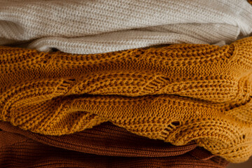 Texture of differnets knitted sweaters