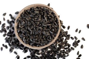Sunflower seeds in a plate on a white background