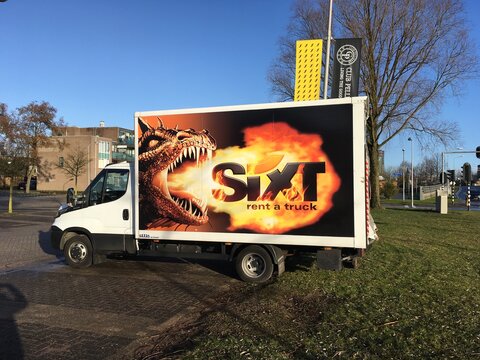 Almere, The Netherlands - Januari 14, 2017: Sixt rental truck, parked by on a public parking spot in the city of Almere.  