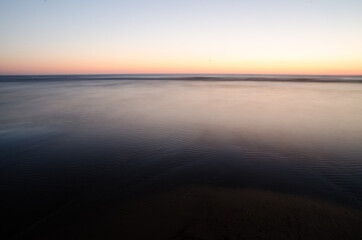 Fototapeta na wymiar long exposure of the sea in the sunset