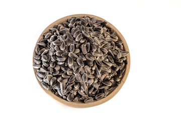 Sunflower seeds in a plate on a white background