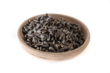 Sunflower seeds in a plate on a white background