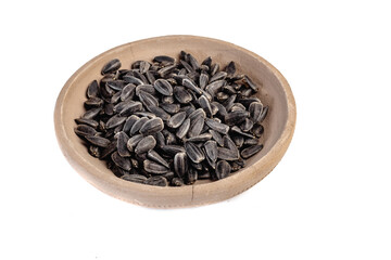 Sunflower seeds in a plate on a white background