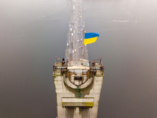 Aerial drone view. Flag of Ukraine on the North Bridge in Kiev.