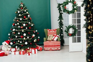 New Year's decor holiday Christmas interior of the Christmas tree pine tree gifts