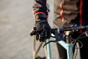 cyclist in black clothes and helmet trains on a bicycle - Powered by Adobe