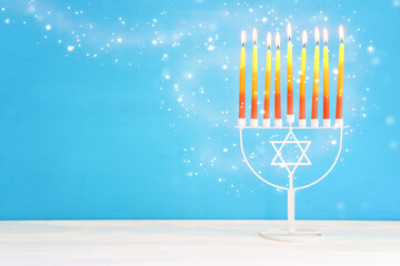 Religion image of jewish holiday Hanukkah background with menorah (traditional candelabra) and candles