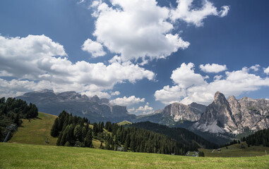 Marmolada massif. Sella group and Sassongher mountain (from Left to Right) as seen from Piz La Ila and La Frainas mountain plateaus, La Villa, Val Badia, Alta Badia, Dolomites, South Tyro, Italy.