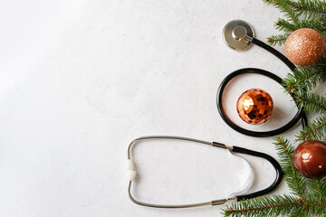 Stethoscope and Christmas decorations. Medical concept. Greeting card. New Year and Christmas.