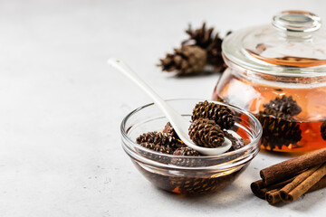 Fototapeta na wymiar Healthy natural therapy,organic pinecone jam. Space for text.