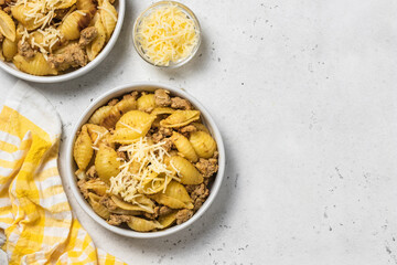 Minced turkey pasta shells. Space for text, top view.