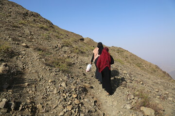  Yemeni women bring their food and drink needs through rugged mountain roads because of  Al-Houthi...