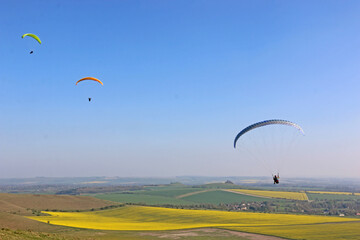 Paragliders flying at Milk Hill, Wiltshire	