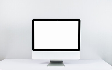  computer isolated on white screen on office style desk..