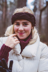 A beautiful girl walks through the winter fairy forest