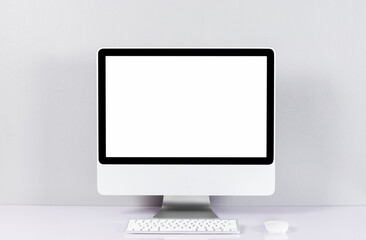  computer isolated on white screen on office style desk..