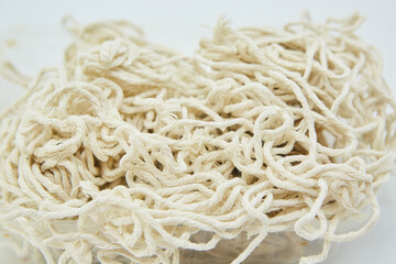 There is a lot of white cotton thick thread or rope. Use in food production or packaging. Industrial use