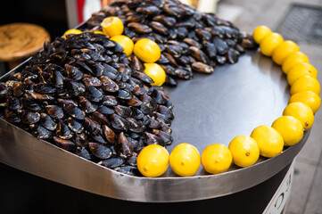 Stuffed mussels with lemon - street food in Istanbul, Turkey