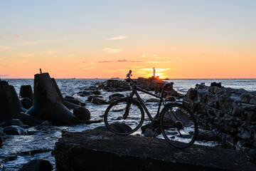 bicycle on the beach in the sunset
