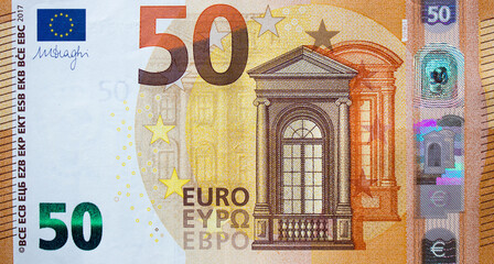 Fragment part of 50 euro banknote close up with brown details - obrazy, fototapety, plakaty