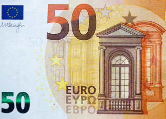 Fragment part of 50 euro banknote close up with brown details