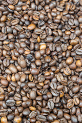 Black coffee beans photographed from above - flat lay.