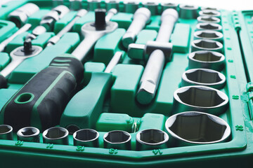 Mechanics Tool Set and Mechanic's Tool Box close-up. Plastic green Storage Box Case. Mechanics Tool...