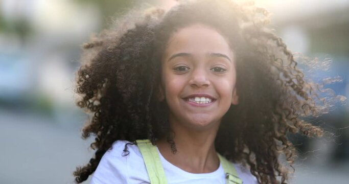 Beautiful mixed race little girl child smiling outside