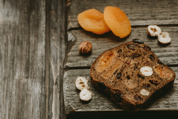 rustic Breakfast bread with dried fruit on a wooden Board 